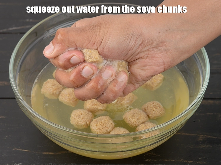 Step 8 – <p><span style="background-color:rgb(255,255,255);color:rgb(0,0,0);">Squeeze out the water from the soya chunks and keep aside.</span></p>