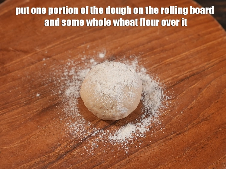 Step 20 – <p>Put one portion of the dough on the rolling board and some whole wheat flour …