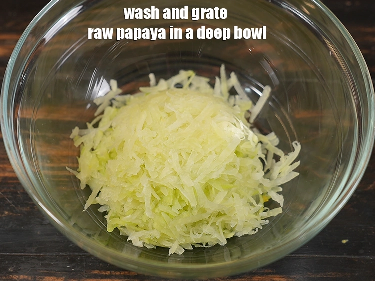 Step 8 – <p><span style="background-color:rgb(255,255,255);color:rgb(0,0,0);">Wash and grate the raw papaya in a deep bowl.</span></p>