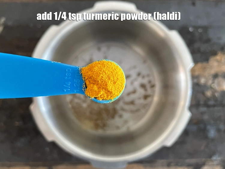 Step 26 – <html><head></head><body><p>Add&nbsp;1/4 tsp&nbsp;<a href="glossary-turmeric-powder-haldi-645i">turmeric powder (haldi)</a>.</p></body></html>