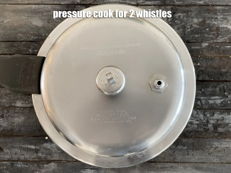 Step 35 – <p>Pressure cook for 2 whistles.&nbsp;Allow the steam to escape before opening the lid.</p>