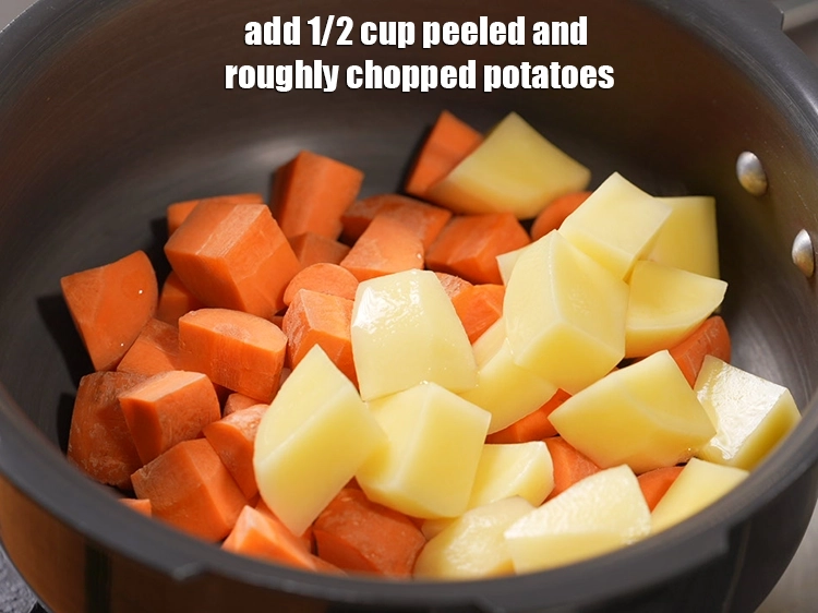 Step 14 – <p>Add 1/2 cup&nbsp;peeled and roughly&nbsp;<a href="https://www.tarladalal.com/glossary-chopped-potatoes-787i">chopped potatoes</a>.</p>