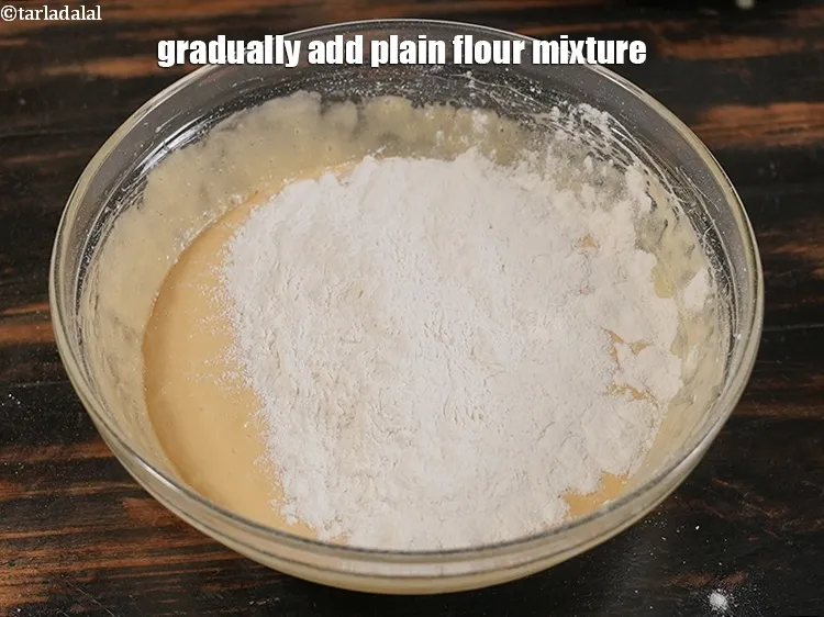 Step 16 – <p>Gradually add plain flour mixture.</p>