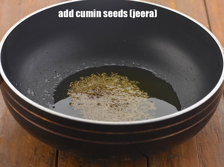 Step 16 – <p>Once the ghee is hot, add the <span style="background-color:rgb(255,255,255);color:rgb(0,0,0);">1 tsp </span><a href="https://www.tarladalal.com/glossary-cumin-seeds-jeera-zeera-381i"><u>cumin seeds (jeera)</u></a>.</p>