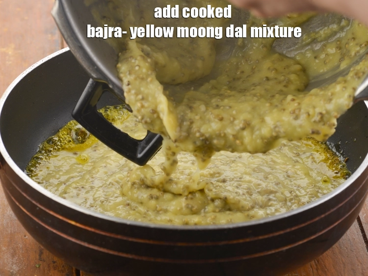 Step 19 – <p>Add the cooked bajra- yellow moong dal mixture.</p>