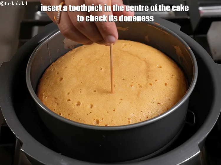 Step 22 – <p>Insert a toothpick in the center of the cake to check its doneness.</p>