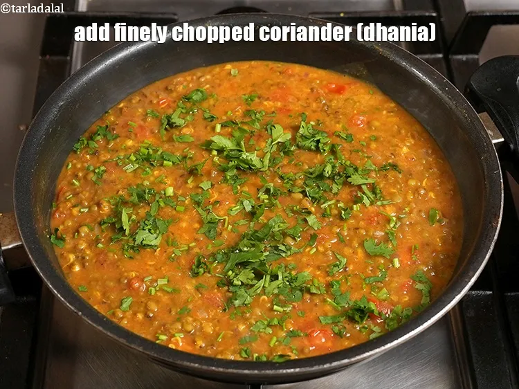 Step 30 – <p>Add&nbsp;2 tbsp&nbsp;finely&nbsp;<a href="https://www.tarladalal.com/glossary-chopped-coriander-783i">chopped coriander (dhania)</a>.</p>