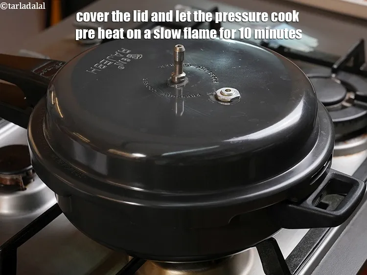 Step 5 – <p>Cover the lid and let the pressure cook pre heat on a slow flame for …