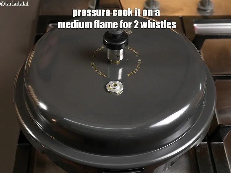 Step 7 – <p>Pressure cook it on a medium flame for 2 whistles.</p>