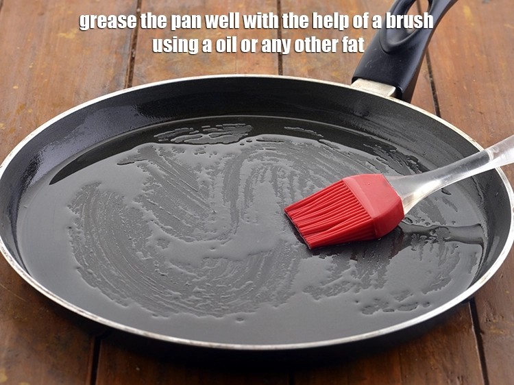 Step 13 – <p>Grease the pan well with the help of a brush using a <a href="https://www.tarladalal.com/glossary-oil-671i"><u>oil</u></a> or …