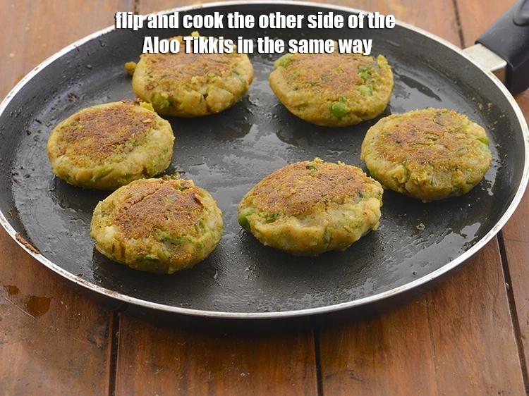 Step 16 – <p>Flip and cook the other side of the&nbsp;<strong>Aloo Tikkis</strong>&nbsp;in the same way.</p>