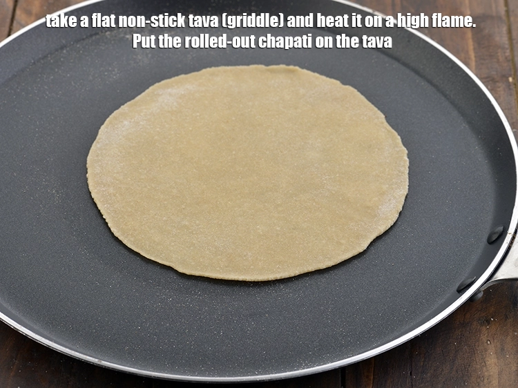 Step 12 – <p>Take a flat non-stick <i>tava</i> (griddle) and heat it on a high flame. Put the …