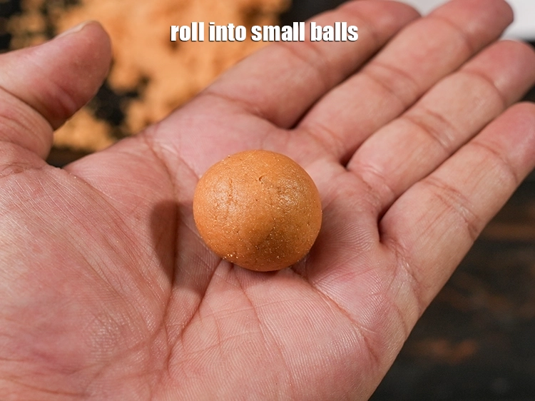 Step 9 – <p style="margin-left:0px;">Roll into small balls. <span style="color:rgb(0,0,0);">Dried ginger can be quite pungent and spicy. Rolling …