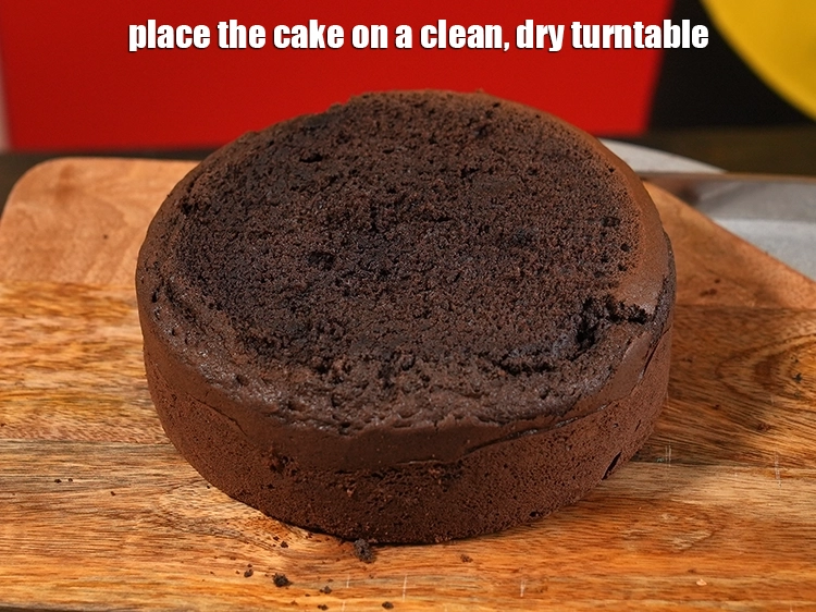Step 11 – <p>Place the cake on a clean, dry turn table.</p>