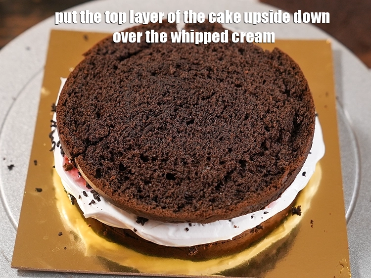 Step 24 – <p>Put the top layer of the cake upside down over the whipped cream. <span style="background-color:rgb(255,255,255);color:rgb(0,0,0);">Press …