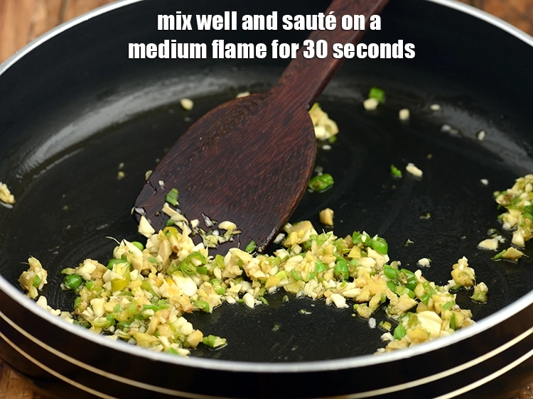 Step 14 – <p>Mix well and sauté on a medium flame for 30 seconds.</p>