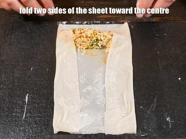 Step 21 – <p>Fold two sides of the sheet toward the centre.</p>