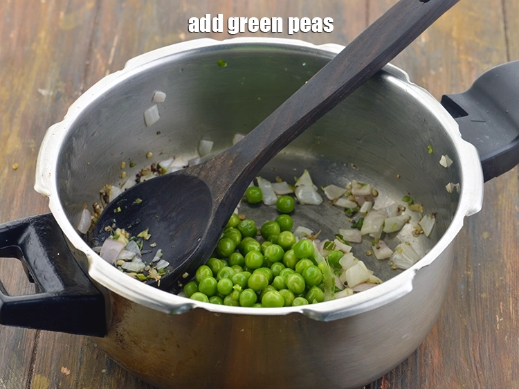 Step 19 – <p><span style="background-color:rgb(255,255,255);color:rgb(0,0,0);">We will now add the vegetables. First add the 1/4 cup </span><a href="https://www.tarladalal.com/glossary-green-peas-matar-hare-matar-vatana-180i"><u>green peas</u></a><span …