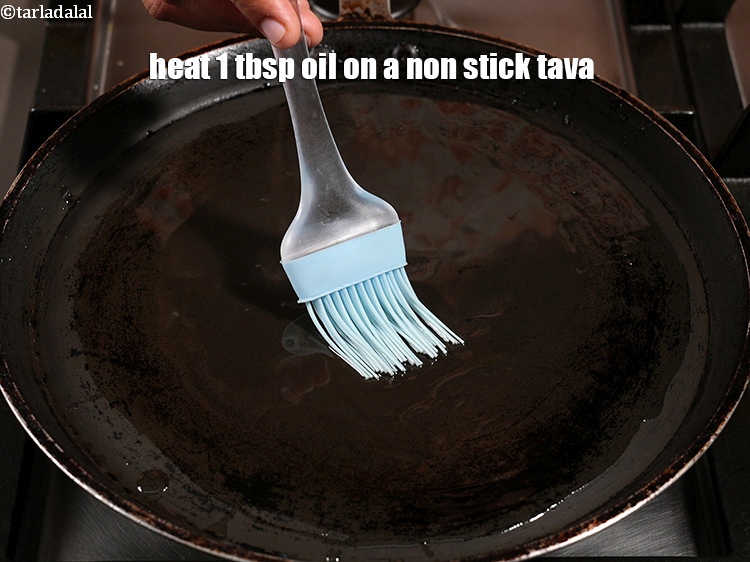 Step 52 – <p>Heat 1 tbsp oil on a&nbsp;non stick tava (griddle).</p>
