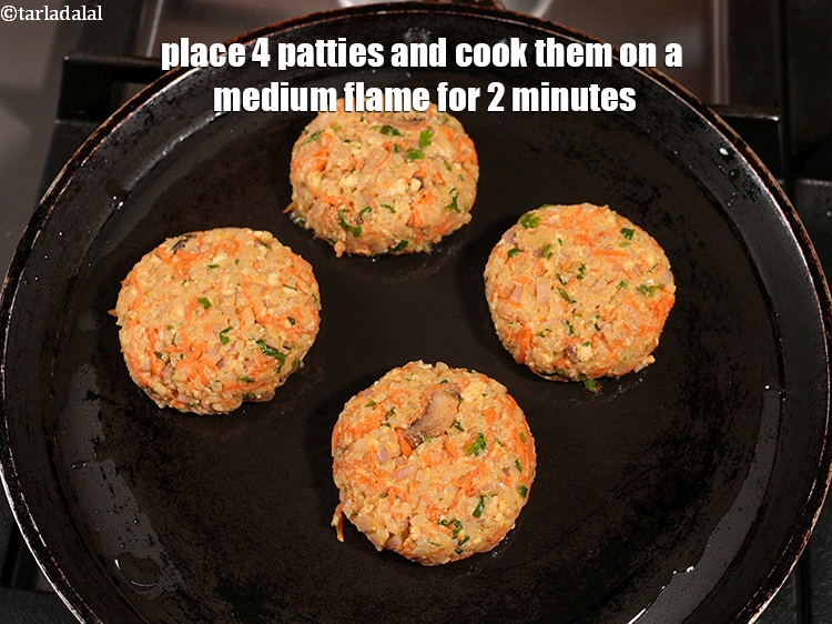 Step 53 – <p>Place 4 patties and cook them on a medium flame for 2 minutes.</p>