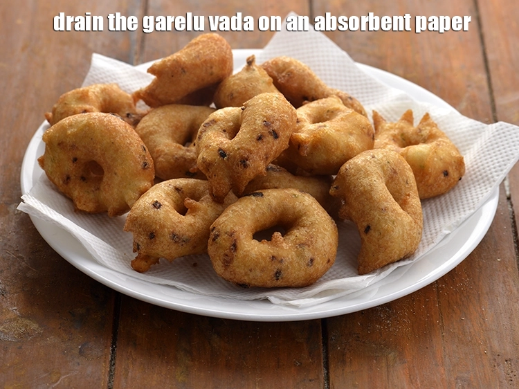 Step 27 – <p>Drain the <strong>garelu vada</strong> on an absorbent paper.</p>