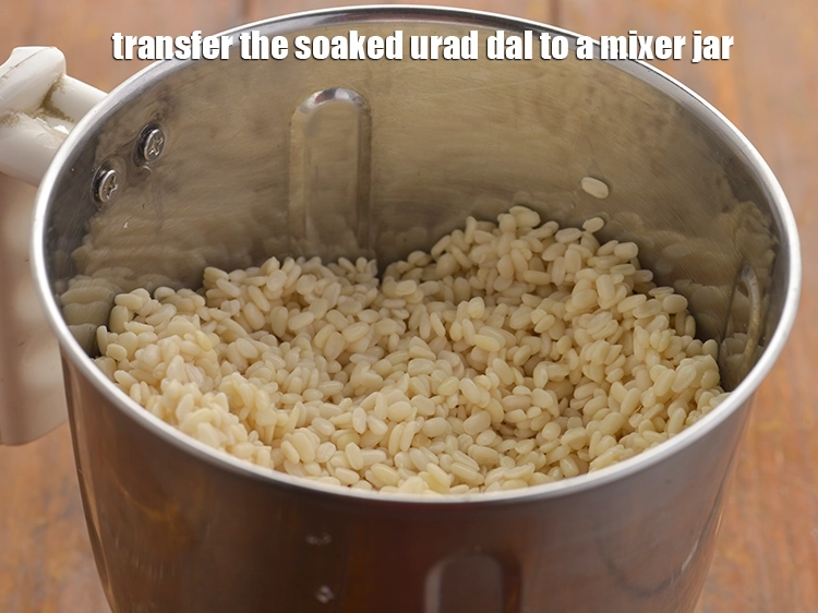 Step 12 – <p>Transfer the soaked urad dal to a mixer jar.</p>