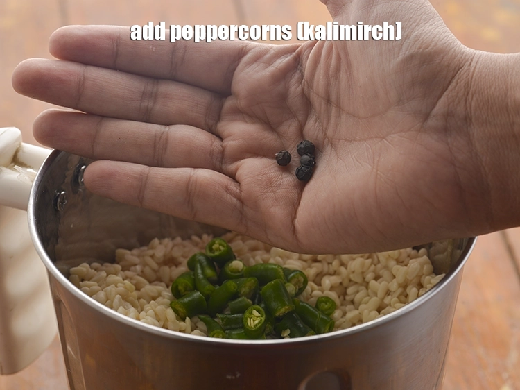 Step 14 – <p>Add the <span style="background-color:rgb(255,255,255);color:rgb(0,0,0);">3 to 4 </span><a href="https://www.tarladalal.com/glossary-peppercorns-584i"><u>peppercorns (kalimirch)</u></a>.</p>