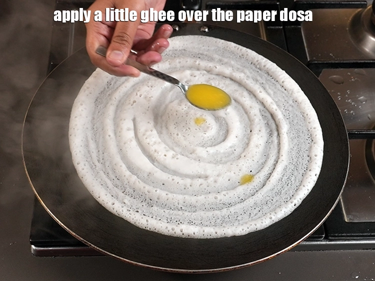 Step 15 – <p><span style="background-color:rgb(255,255,255);color:rgb(0,0,0);">Apply a little </span><a href="https://www.tarladalal.com/glossary-ghee-245i"><u>ghee</u></a><span style="background-color:rgb(255,255,255);color:rgb(0,0,0);"> over the&nbsp;</span><strong>paper dosa | crispy paper dosa | …