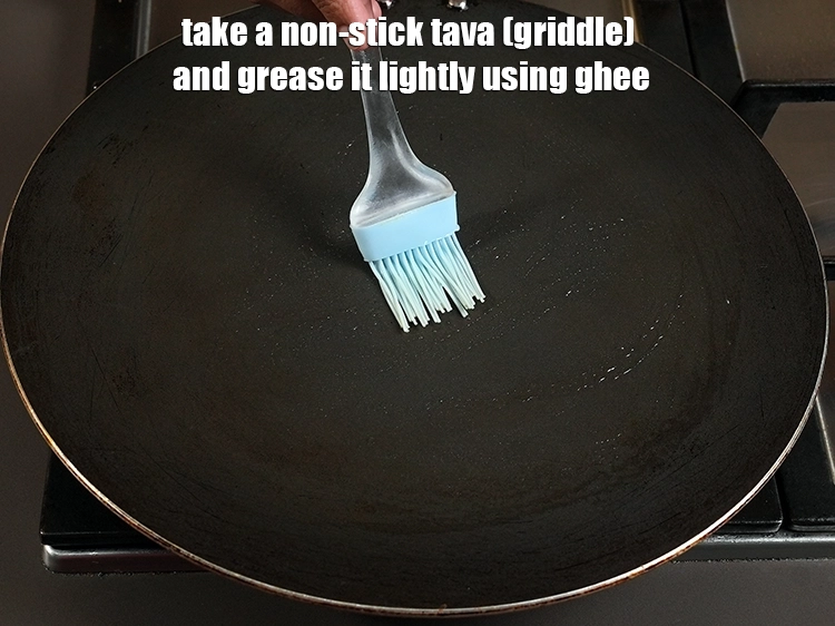 Step 10 – <p>Take a non-stick tava (griddle) and grease it lightly using <a href="https://www.tarladalal.com/glossary-ghee-245i"><u>ghee</u></a>. Let it get …