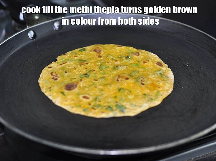 Step 20 – <p>Cook till the <strong>methi thepla</strong> turns golden brown in colour from both sides.</p>