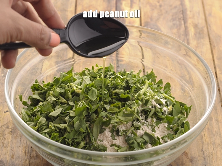 Step 7 – <p>Add <span style="background-color:rgb(255,255,255);color:rgb(0,0,0);">1 tbsp </span><a href="https://www.tarladalal.com/glossary-peanut-oil-groundnut-oil-sing-tel-920i"><u>peanut oil</u></a>. This not only helps in preventing the dough …