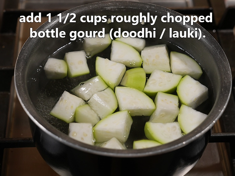 Step 6 – <html><head><meta charset="UTF-8"></head><body><p>Add 1 1/2 cups&nbsp;roughly&nbsp;<a href="glossary-chopped-bottle-gourd-401i">chopped bottle gourd (doodhi / lauki)</a>. There is no need …