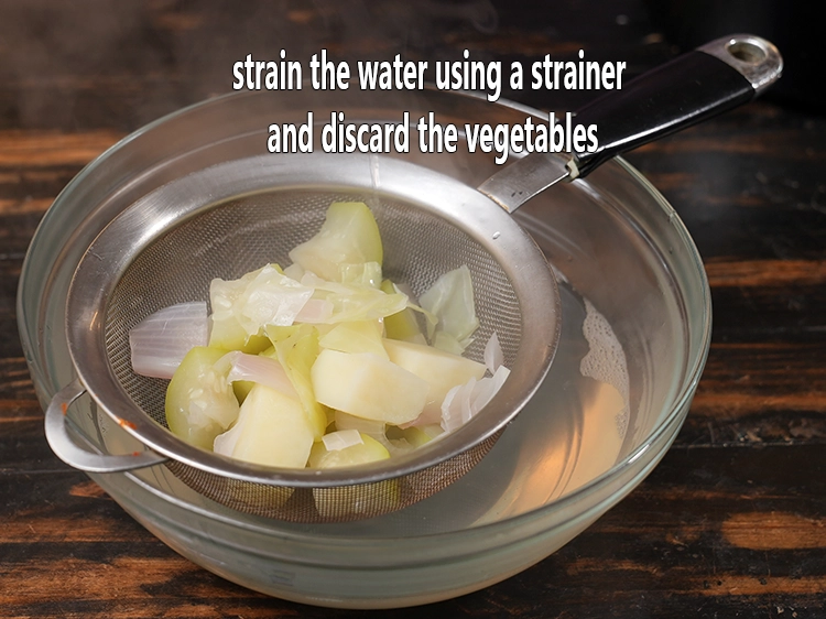 Step 12 – <p>Strain the water using a strainer and discard the vegetables.</p>