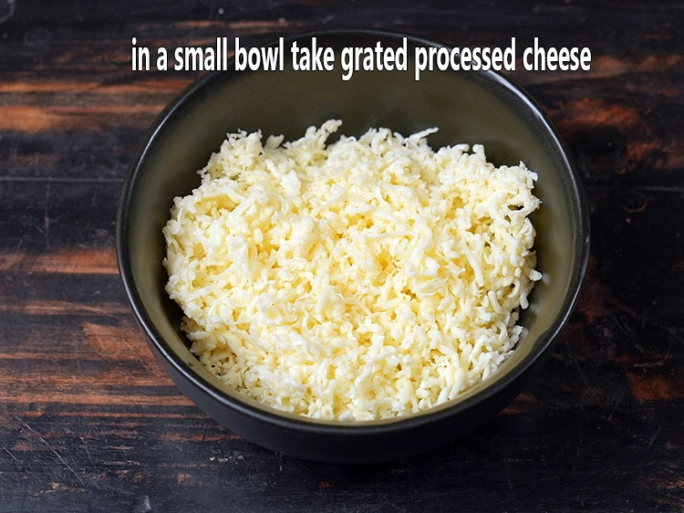 Step 1 – <p>For the topping of mini cheese uttapam, in a small bowl take grated processed cheese.&nbsp; …