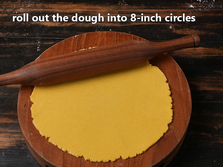 Step 9 – <p>Next, roll out the dough into <strong>8-inch circles</strong> using a little plain flour to prevent …