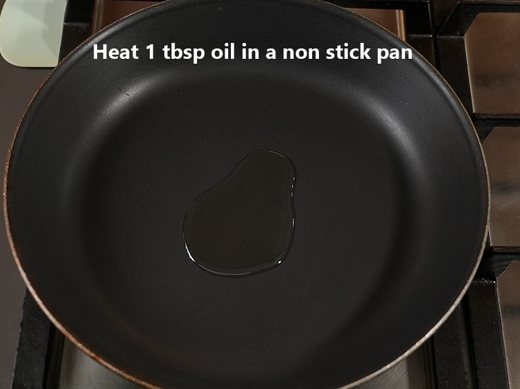 Step 3 – <p>Heat 1 tbsp <a href="/glossary-oil-671i"><u>oil</u></a> in a non stick pan.</p>