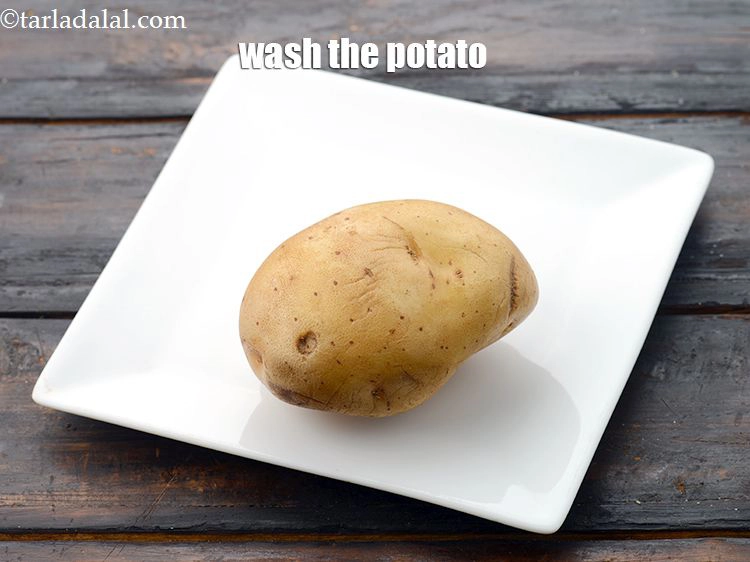 Step 3 – <p>To make potato strips, wash a potato&nbsp;well.&nbsp;</p>