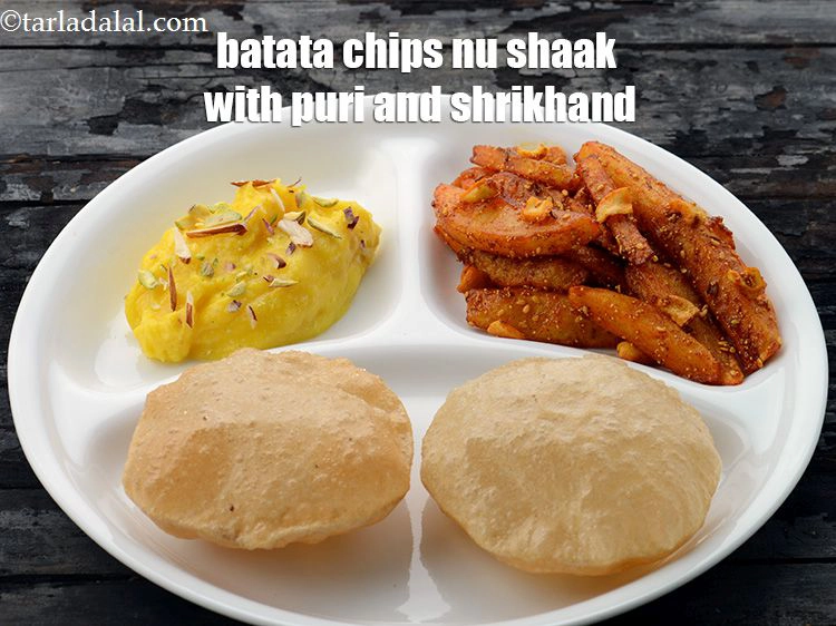 Step 26 – <p>Serve <strong>batata chips nu shaak </strong>with <a href="https://www.tarladalal.com/puris--how-to-make-pooris--4394r">puri </a>and <a href="https://www.tarladalal.com/quick-shrikhand-38947r">shrikhand</a>.&nbsp;</p>