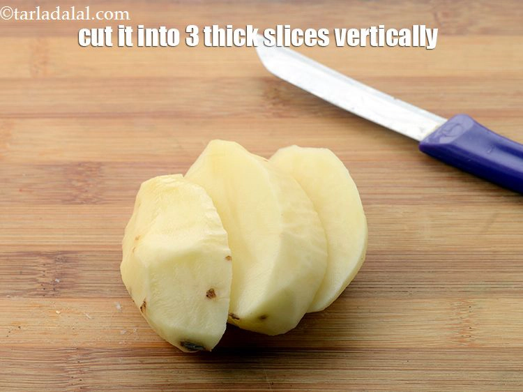 Step 5 – <p>Place the potato on a chopping board horizontally and cut it into 3 thick slices …