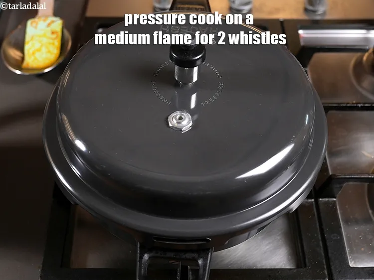 Step 27 – <p>pressure cook on a medium flame for 2 whistles.</p>