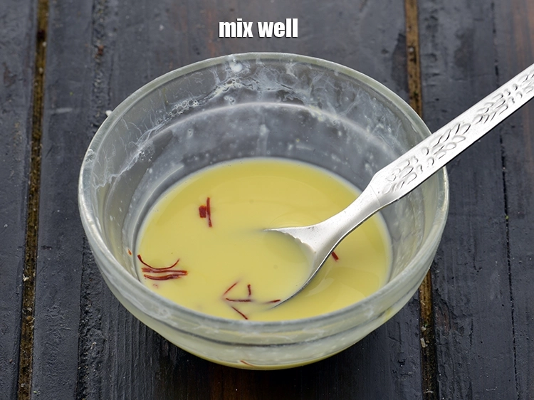 Step 13 – <p>Rub the saffron strands into the milk till it dissolves. This is what will give …