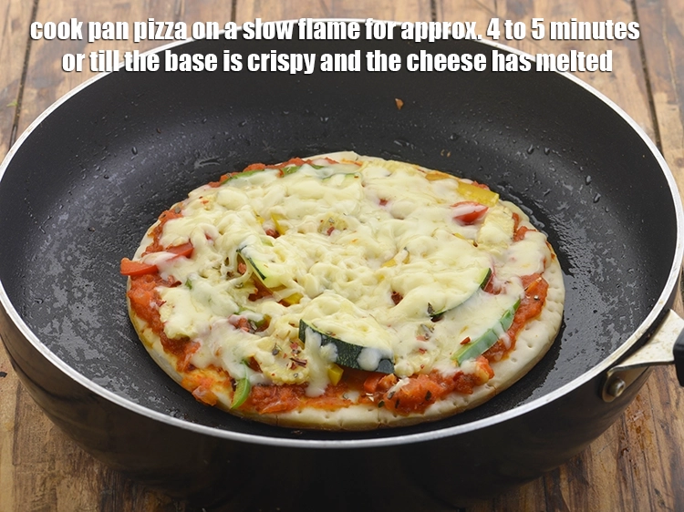 Step 33 – <p>Cook <strong>pan pizza</strong> on a slow flame for approx. 4 to 5 minutes or till …