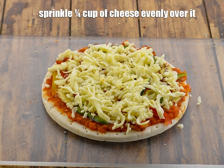 Step 29 – <p>Sprinkle ¼ cup of cheese evenly over it. Grate the cheese little thickly using a …