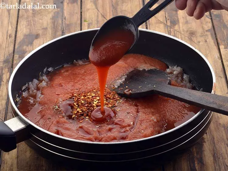 Step 18 – <p>Add the tomato ketchup. This gives a little colour and sweetness to the sauce.</p>
