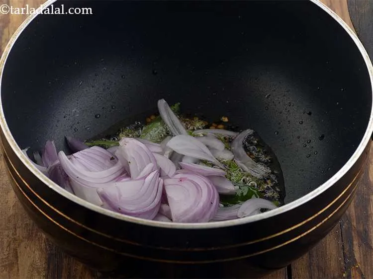 Step 24 – <p>Add the <span style="background-color:rgb(255,255,255);color:rgb(0,0,0);">1/2 cup thinly </span><a href="https://www.tarladalal.com/glossary-onions-pyaz-pyaaz-kanda-548i#ing_2342"><u>sliced onions</u></a>.</p>