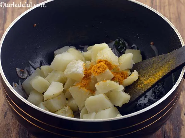 Step 27 – <p><span style="color:rgb(0,0,0);">Add the salt and turmeric powder.</span></p>