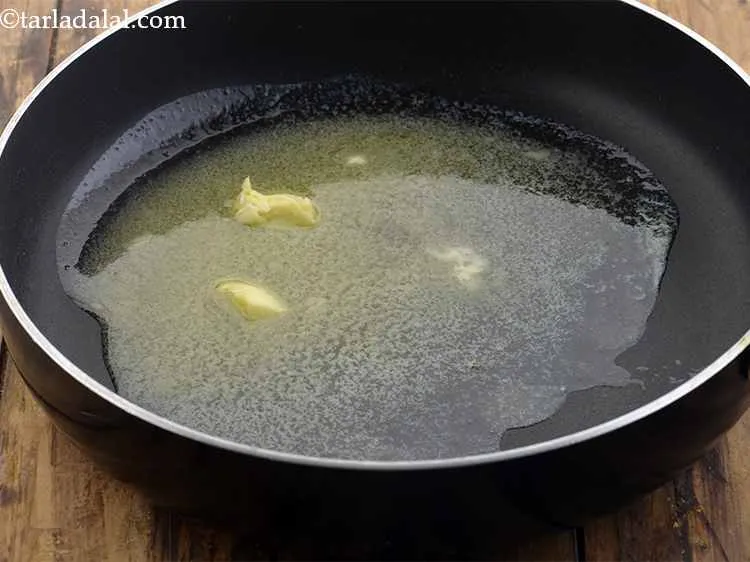 Step 34 – <p>For the <strong>Mysore masala dosa stuffing</strong>, heat the butter in a broad non-stick pan. You …