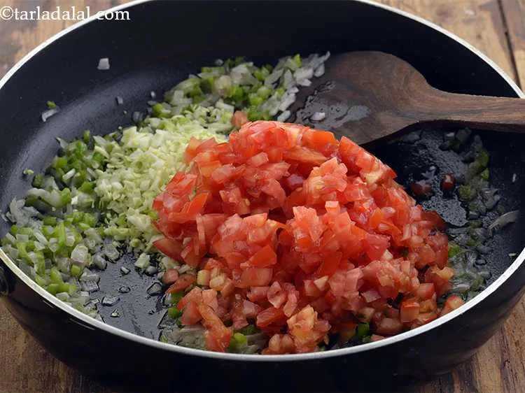 Step 38 – <p>Add the tomatoes. They provide a slight tang and juicy texture to the <strong>Mysore masala …