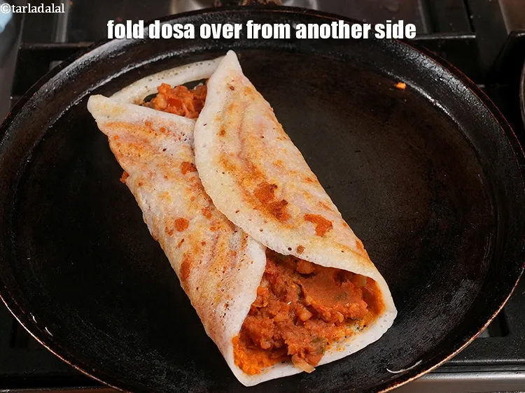 Step 59 – <p>Fold&nbsp; <strong>Mysore masala dosa</strong>&nbsp;over from another side.</p>