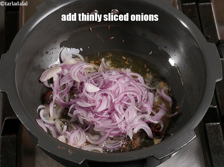 Step 30 – <p>Add 1 cup&nbsp;thinly&nbsp;<a href="https://www.tarladalal.com/glossary-sliced-onions-745i">sliced onions</a>.</p>